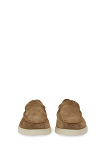 Tods men’s leather slipper loafer in brown tan suede with a minimalist design and white rubber soles