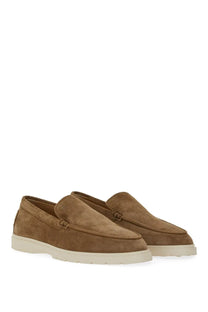 Tod’s men’s leather slipper loafer in brown tan suede with white rubber sole and classic moccasin design
