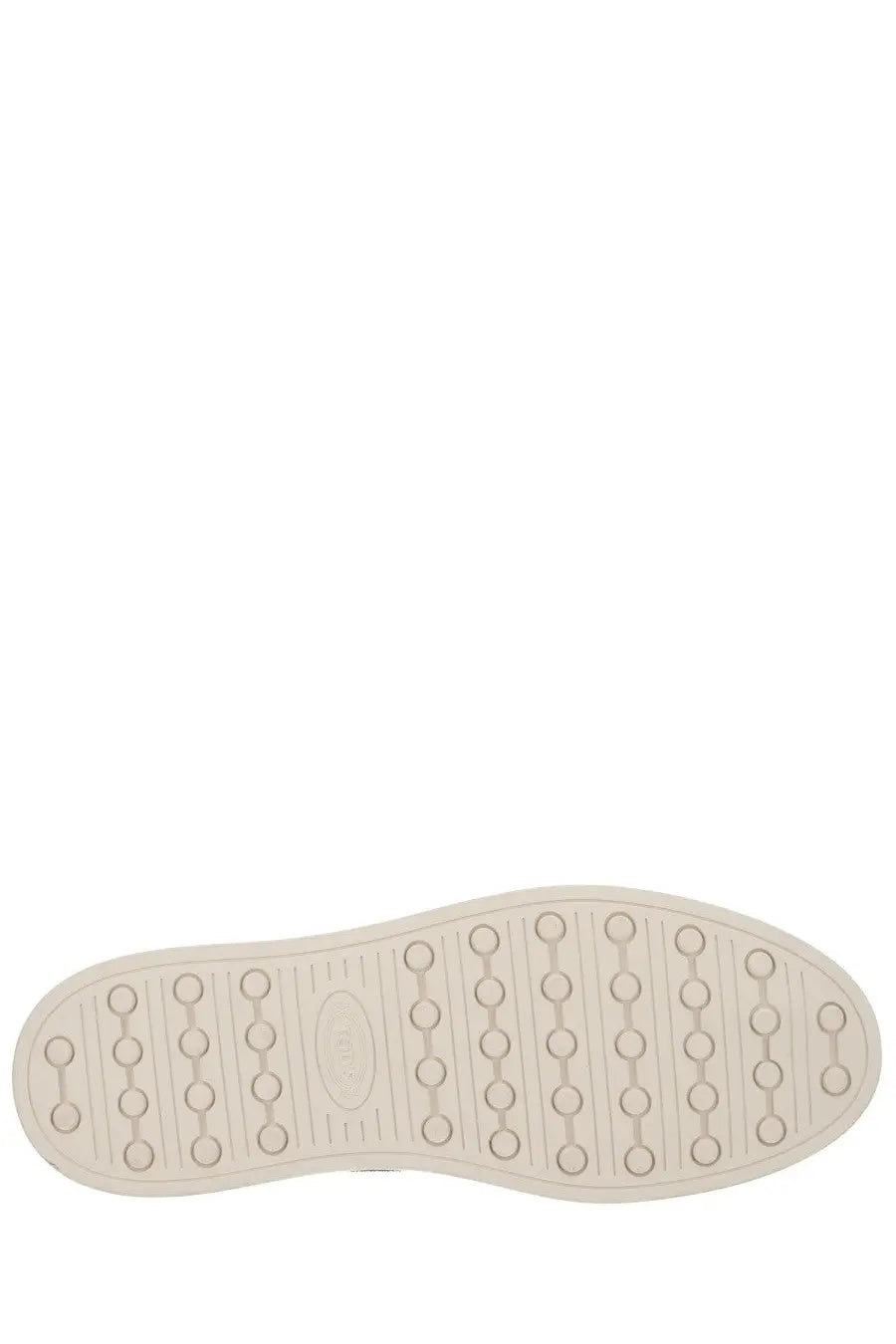 Cream-colored rubber sole with circular indentations and oval logo on tod’s men’s moccasin cassette beige back side