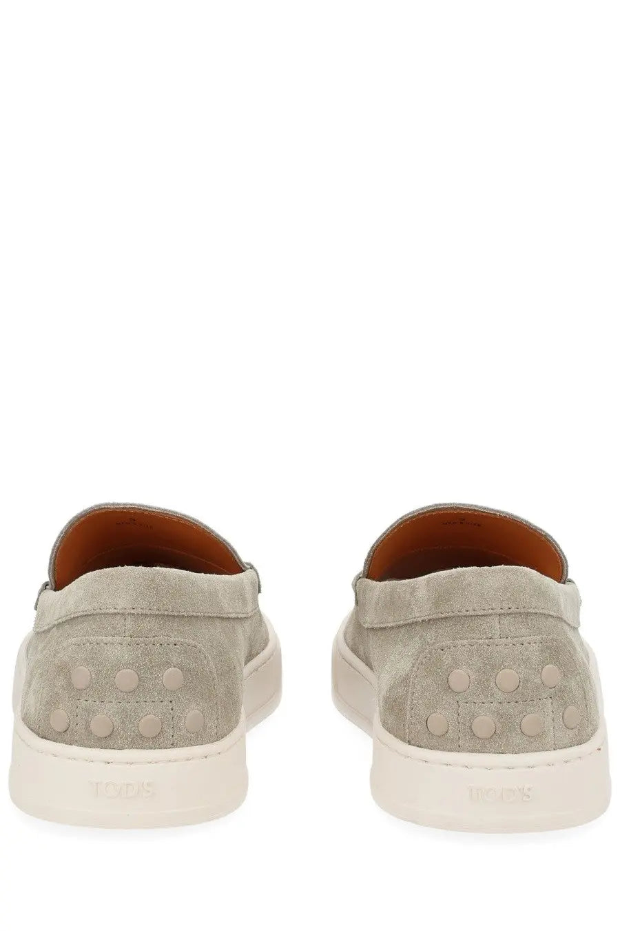 Tod’s men’s moccasin cassette beige gray suede slip-on sneakers with white rubber soles and circular heel studs back view