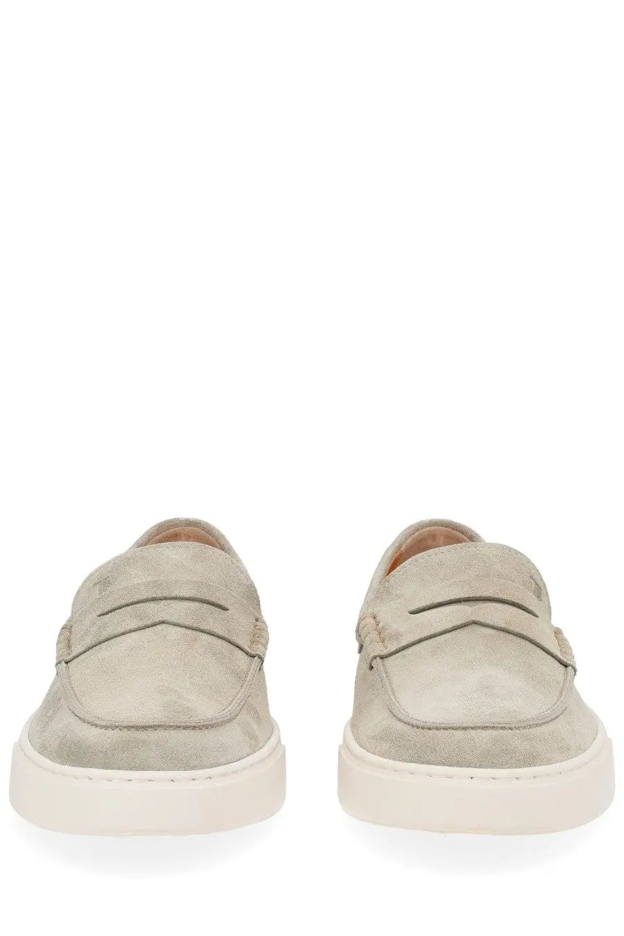 Beige suede Tods men’s moccasin cassette loafers with classic penny loafer design and white rubber soles