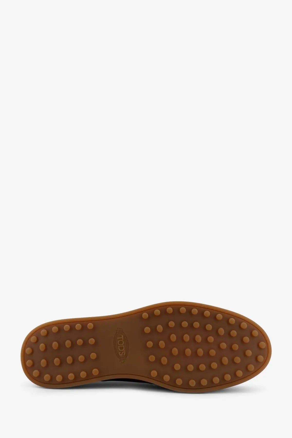 Brown rubber sole with circular studs and todds logo embossed near the heel of todds men’s suede loafers brown
