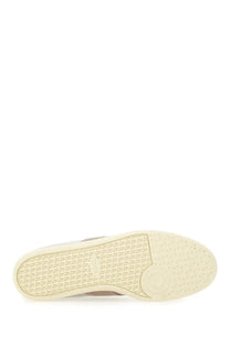 Tod’s men’s tabs sneaker beige with cream-colored rubber sole featuring a textured pattern and subtle branding