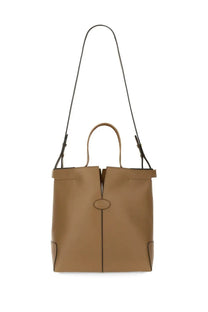 Tod’s women’s beige leather tote bag with tan body black shoulder strap and top handles for everyday use