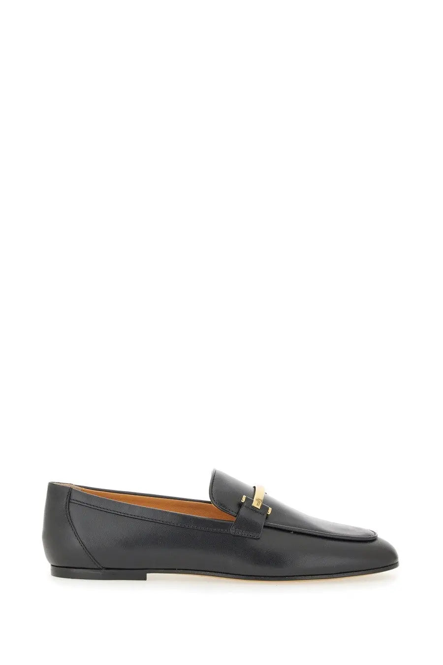 Tod’s women’s black leather loafer with a gold-tone metal bar detail across the toe