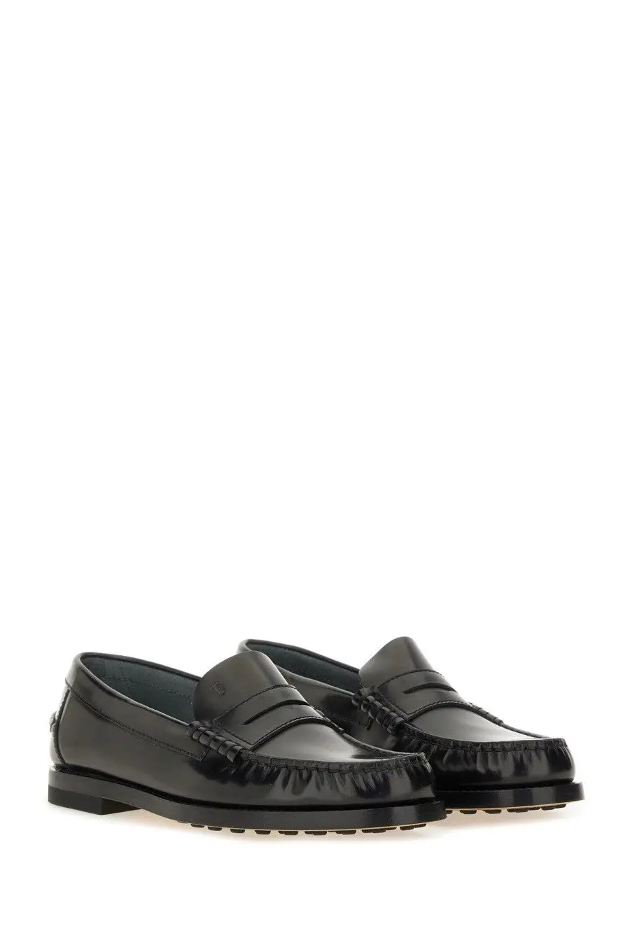 Tod’s women’s black leather loafers with glossy patent finish and classic moccasin-style stitching