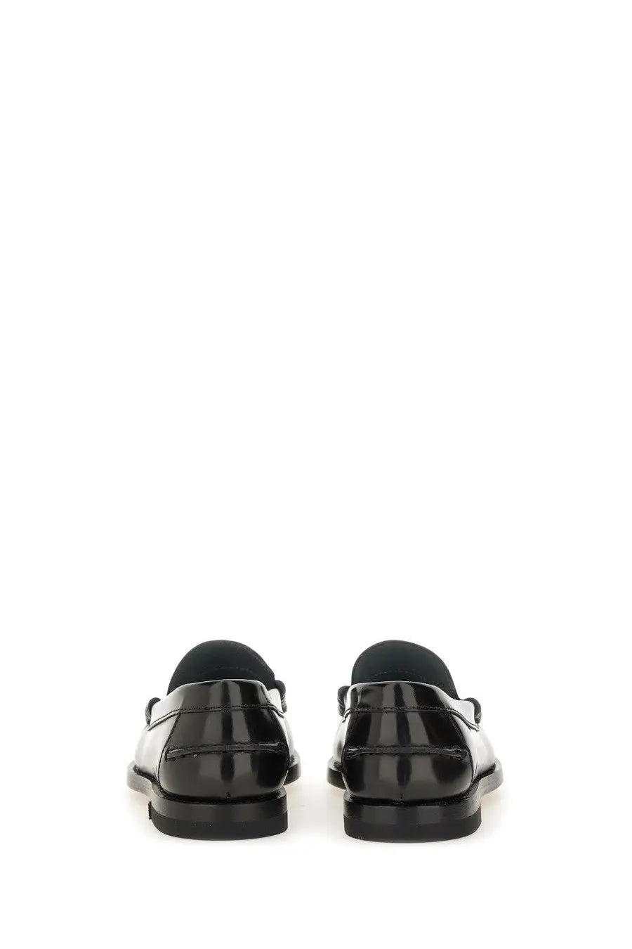 Tod’s women’s leather loafer black patent leather with sleek glossy finish and classic slip-on design