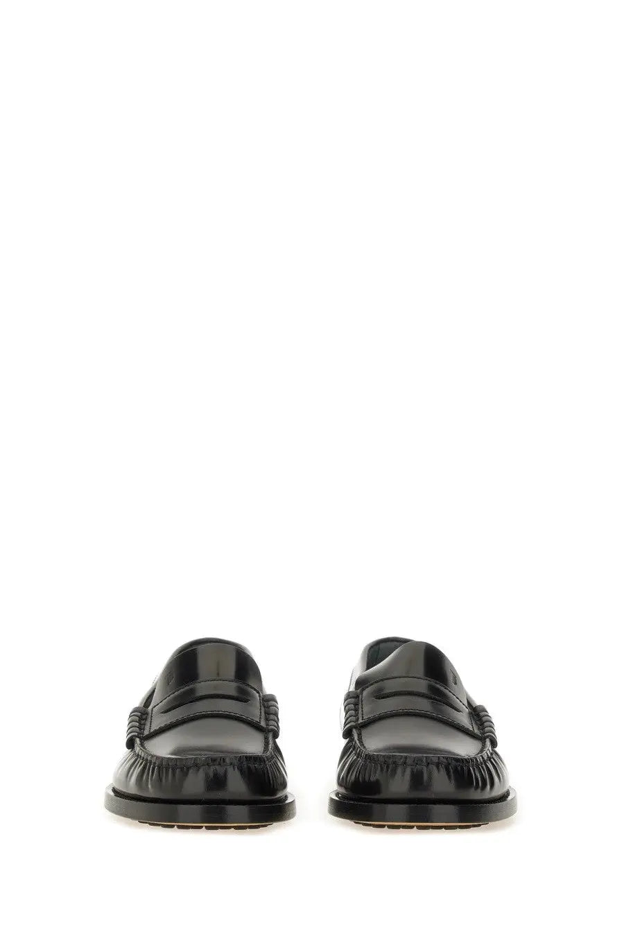 Tod’s women’s leather loafer in black patent leather with glossy finish and stitched detailing