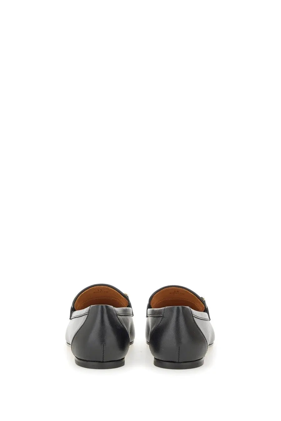 Tod’s women’s leather loafers black and white with sleek minimalist design for stylish everyday wear