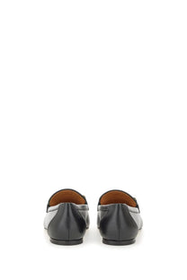 Tod’s women’s leather loafers black and white with sleek minimalist design for stylish everyday wear