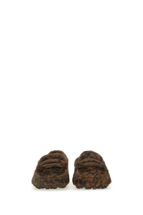 Tod’s women’s moccasin gommino macro black brown faux fur slip-on mules with plush textured surface and slide design