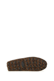 Tod’s women’s moccasin gommino macro black showing brown suede sole with leopard print pattern and black rubber studs