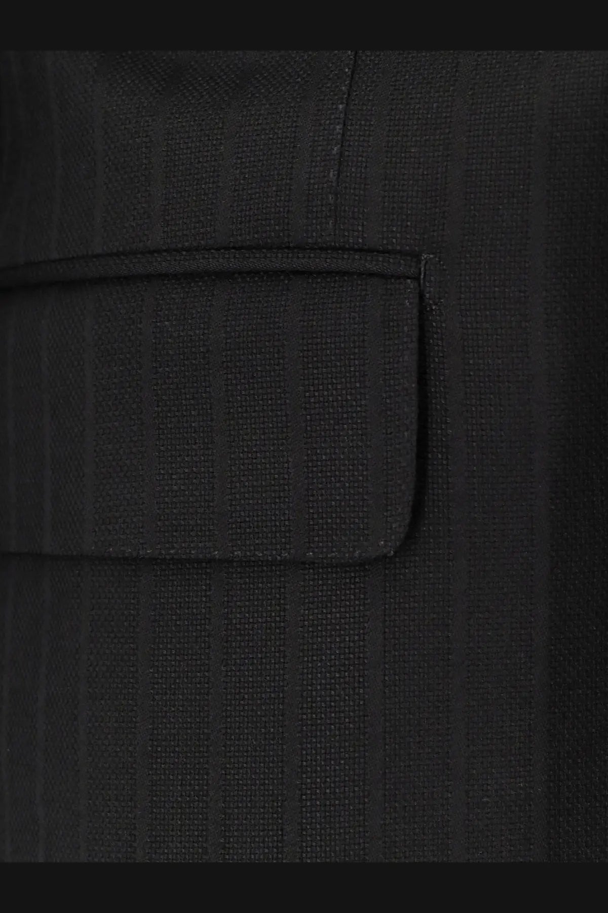 Black pinstripe wool blazer pocket with subtle texture and precise stitching from tom ford men’s atticus collection