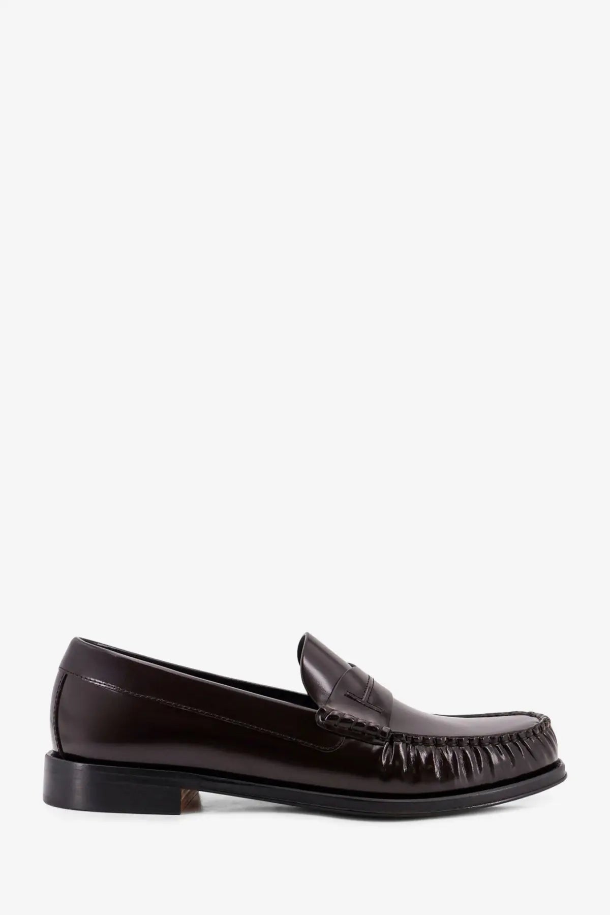 Tom Ford men’s dark brown leather loafer with polished finish and distinctive frayed stitching along the toe