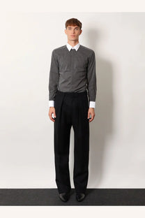 Black pleated trousers with a sleek tailored fit paired with tom ford men’s microfantasy cotton shirt in black