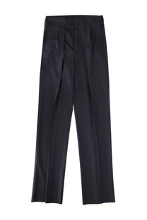 Black pleated trousers with a sleek tailored fit shown from the back in tom ford men’s pinstripe blue pants