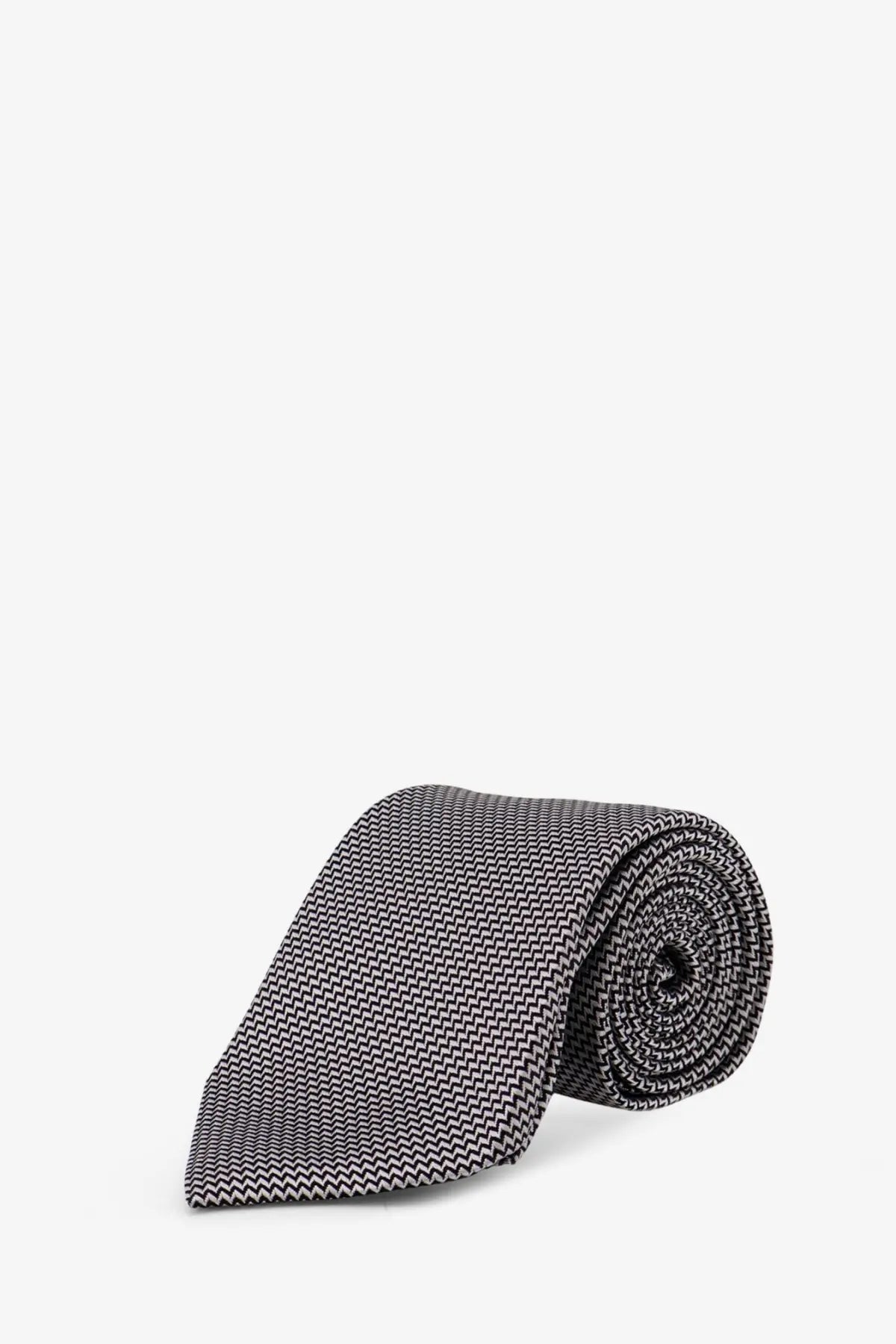 Tom Ford men’s silk tie black with gray and black zigzag pattern neatly rolled for formal wear
