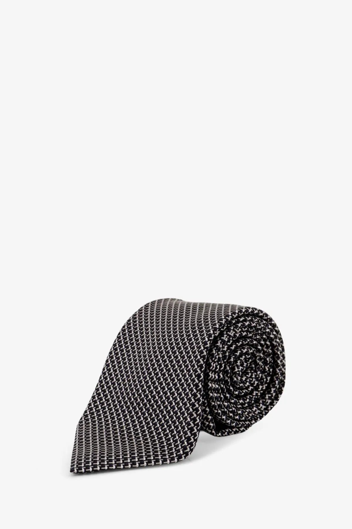 Tom Ford men’s silk tie blue with a sleek black and white pattern rolled neatly for display