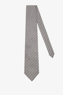 A sleek gray and black herringbone patterned tom ford men’s silk tie with a classic pointed tip