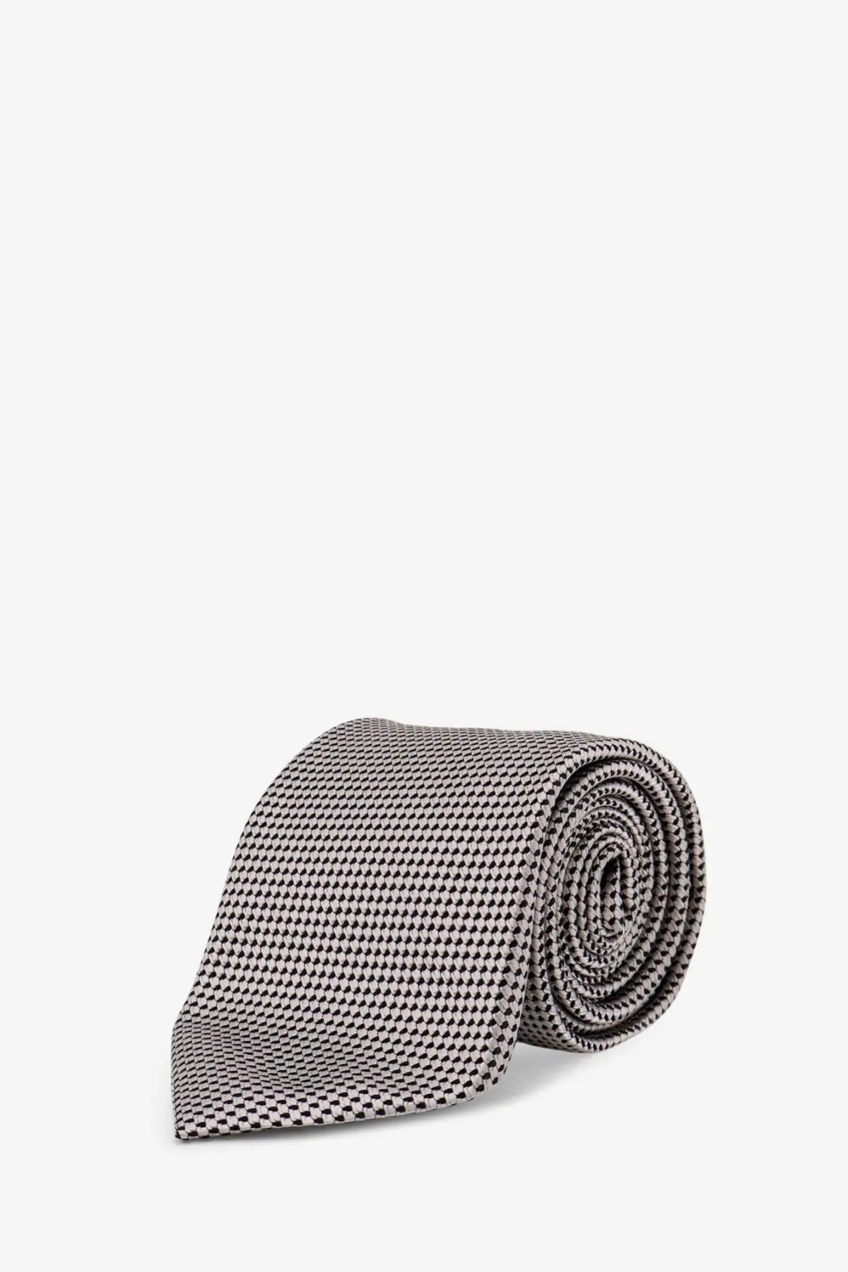 A sleek rolled tom ford men’s silk tie silver in gray with a subtle black and white houndstooth pattern