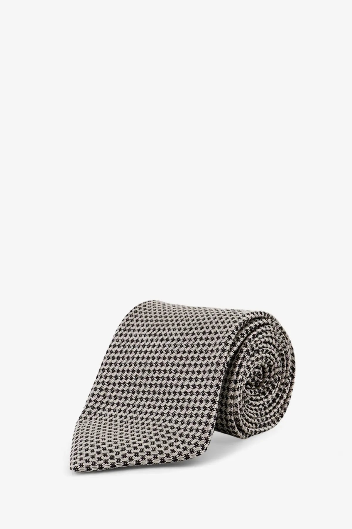 Tom Ford men’s silk tie white featuring a classic black and white houndstooth pattern in fine woven fabric