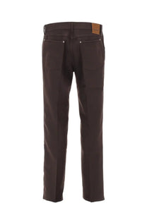 Dark brown denim jeans with classic five-pocket design and tan leather patch on waistband in tom ford men’s wool pants brown