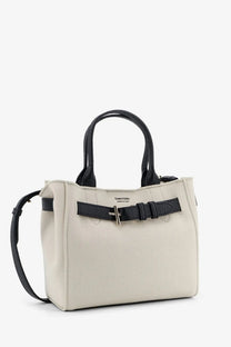 Cream-colored Tom Ford women’s Audrey canvas handbag with black leather handles and matching belt-style strap front