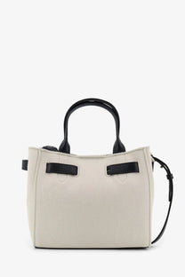 Cream-colored textured tote bag with black leather handles and strap minimalist design by Tom Ford women