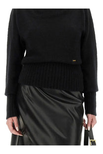 Tom Ford women’s black ribbed knit boat neck sweater with cropped silhouette and gold brand tag at the hem