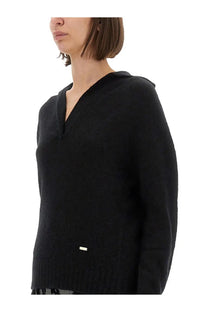Tom Ford women’s black cashmere and silk long sleeve polo shirt with v neck ribbed hem and metallic tag at front