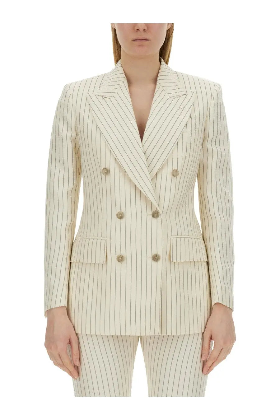 Cream-colored tom ford women’s double breasted blazer with thin vertical pinstripes and matching trousers