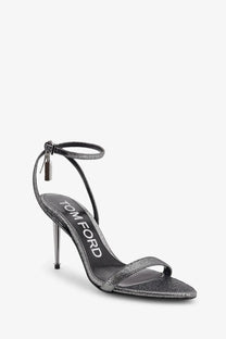Tom Ford women’s silver laminated heeled sandals with silver glitter, slender heel, and ankle strap