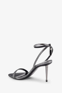 Silver metallic strappy high heeled sandal with sleek slender heel and ankle strap by tom ford womens laminated heels