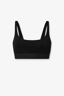Black seamless tom ford women’s modal blend sports bra with thin straps and subtle brand logo on the band