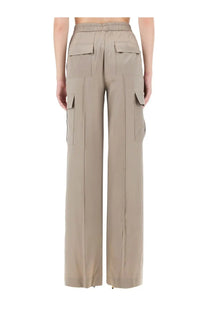 Tom Ford women’s beige wide-leg cargo pants with drawstring waist and multiple flap pockets in soft fabric