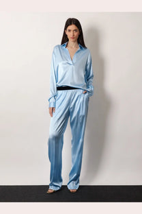 Light blue stretch satin pajama set with button-up shirt and wide-leg pants from tom ford womens pyjamas collection