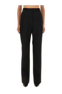 Black Tom Ford women’s high-waisted wool pants with straight-leg cut and structured pleats