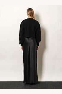 Black satin wide-leg trousers with sleek flowing drape paired with tom ford women’s wool and cashmere sweater black
