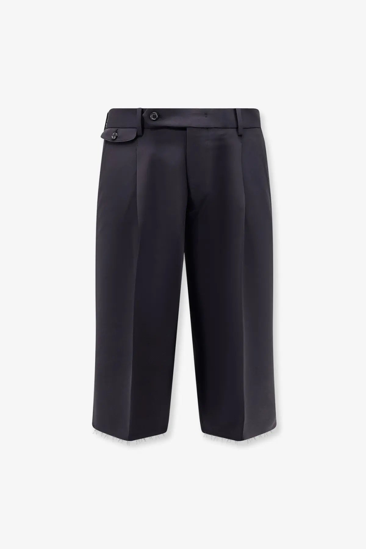 Black pleated trousers with sleek tailored fit and subtle texture paired with tonywack men’s wool blend bermuda shorts blue
