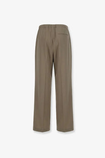 Back view of tonywack men’s wool blend beige trousers with wide legs elastic waistband and single back pocket