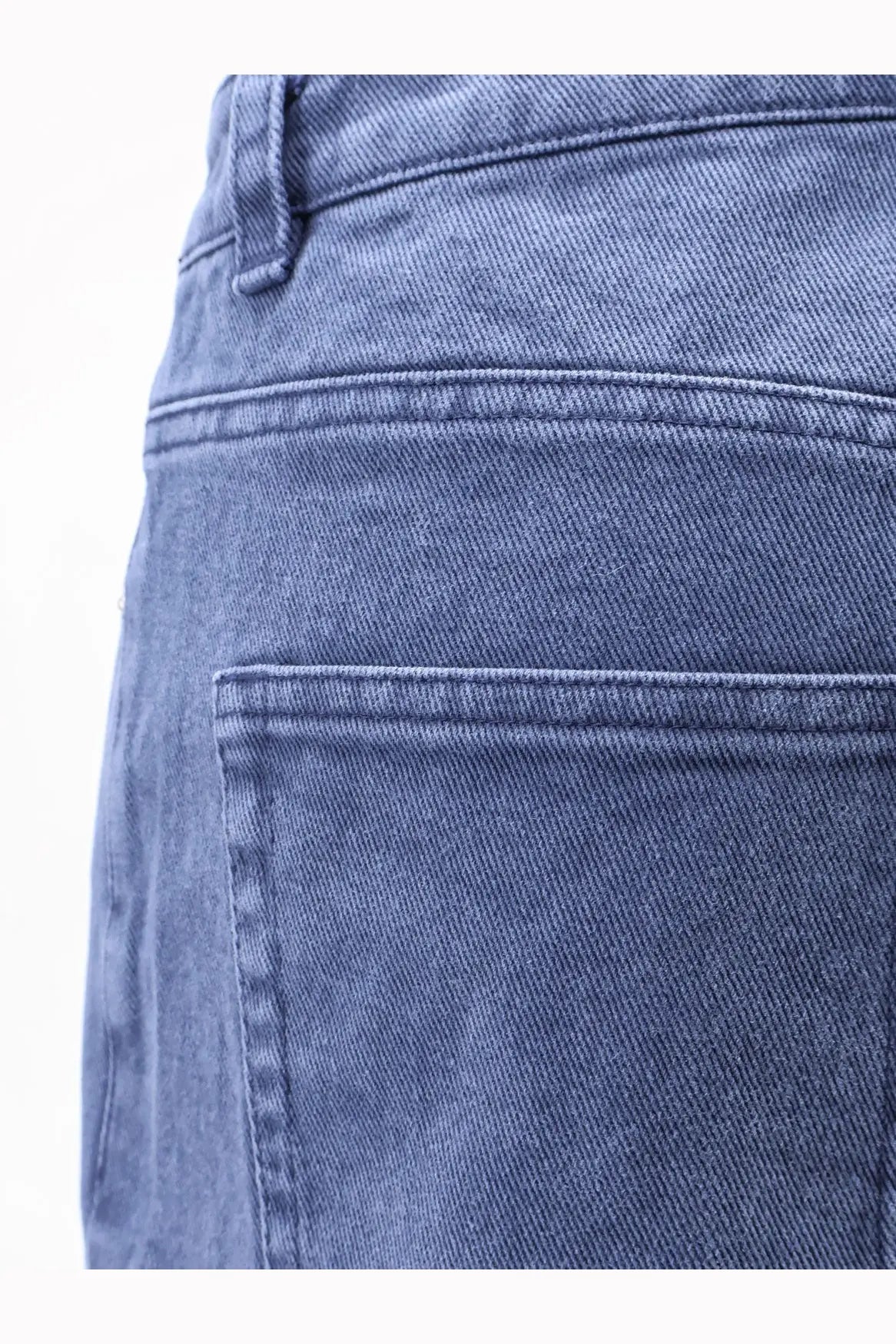 Tonywack women’s blue medium-wash denim jeans featuring classic stitched pocket and belt loop details on back side