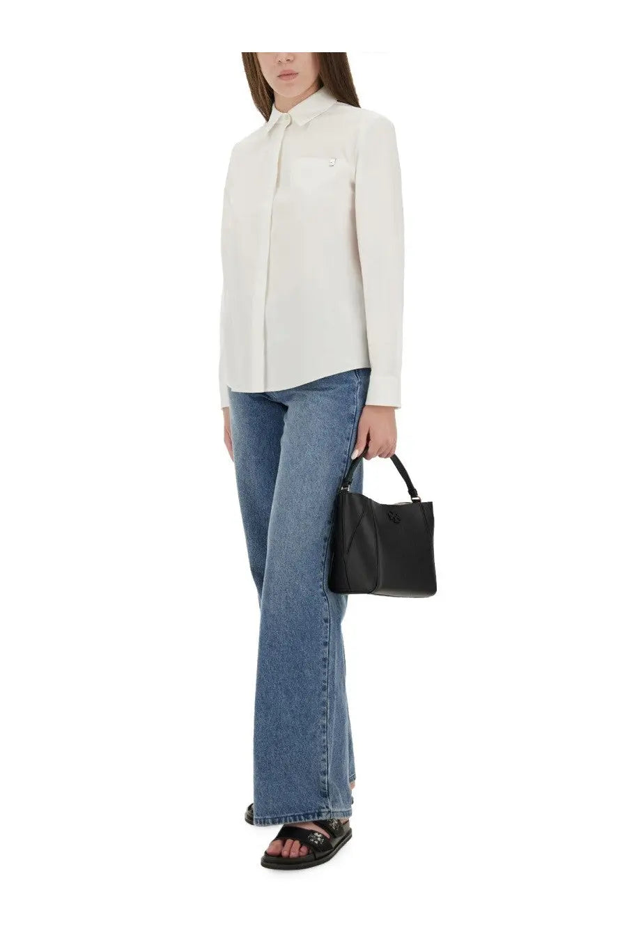 Black leather handbag with structured rectangular shape and top handle complementing tory burch cotton poplin shirt white