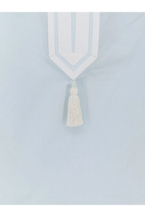 White geometric curtain tie-back with matching tassel complementing the blue cotton tory burch womens tunic shirt