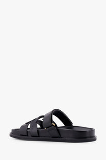 Tory Burch women’s Ines black leather slide sandal with minimalist design and gold tone buckle