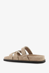 Beige suede slide sandal with black rubber sole and adjustable strap from tory burch womens ines low suede sandals avola
