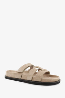 Beige suede tory burch womens ines low slide sandal with black rubber sole and three overlapping straps