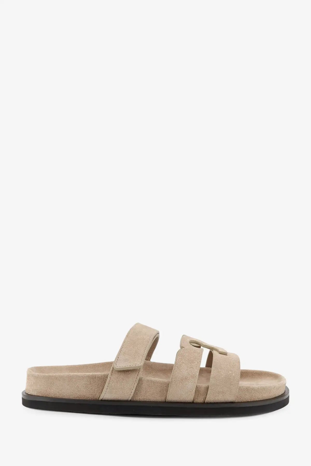 Beige suede Tory Burch women’s Ines low slide sandal with two adjustable straps and black rubber sole front view