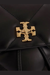 Black quilted leather Tory Burch women’s Kira diamond backpack with gold-tone logo clasp for stylish carrying