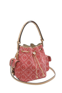 Pink canvas bucket bag with red monogram pattern and beige leather handles and trim by tory burch women’s monogram bag red