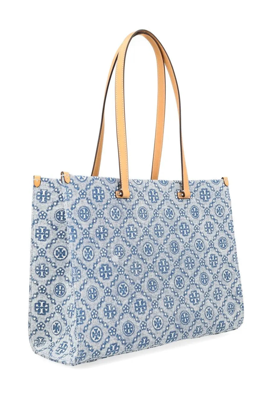 Light blue denim Tory Burch women’s monogram shopper bag with navy logo pattern and tan leather handles
